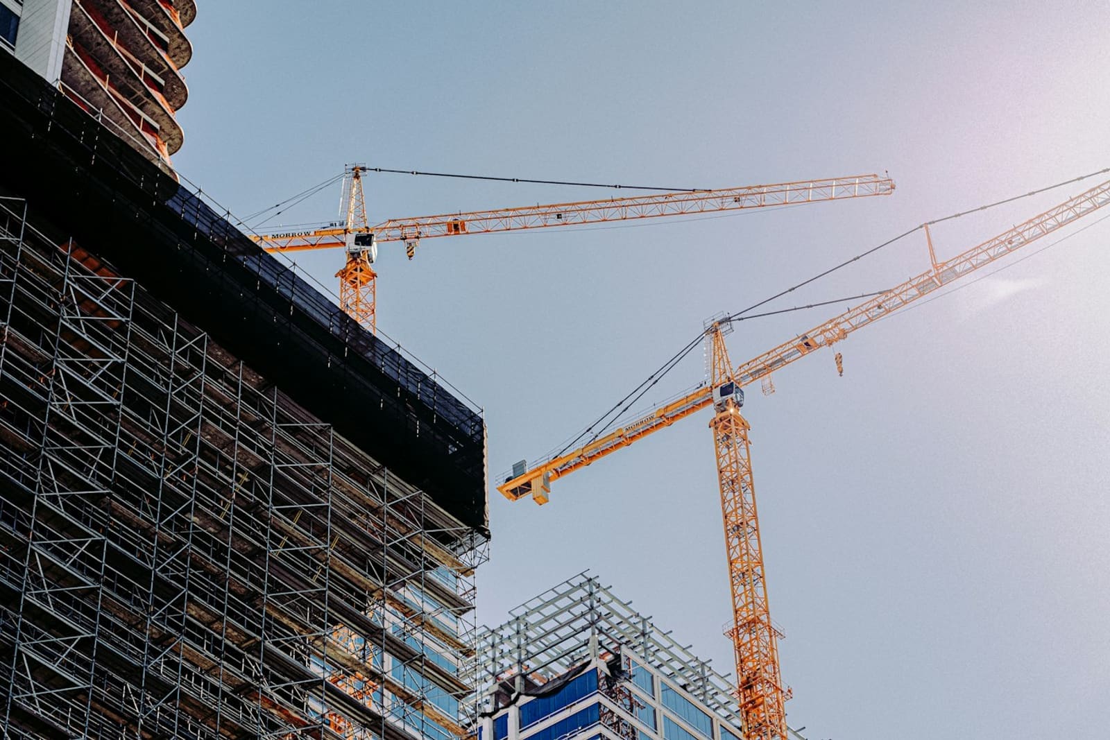 Crane and building frame on an active construction site