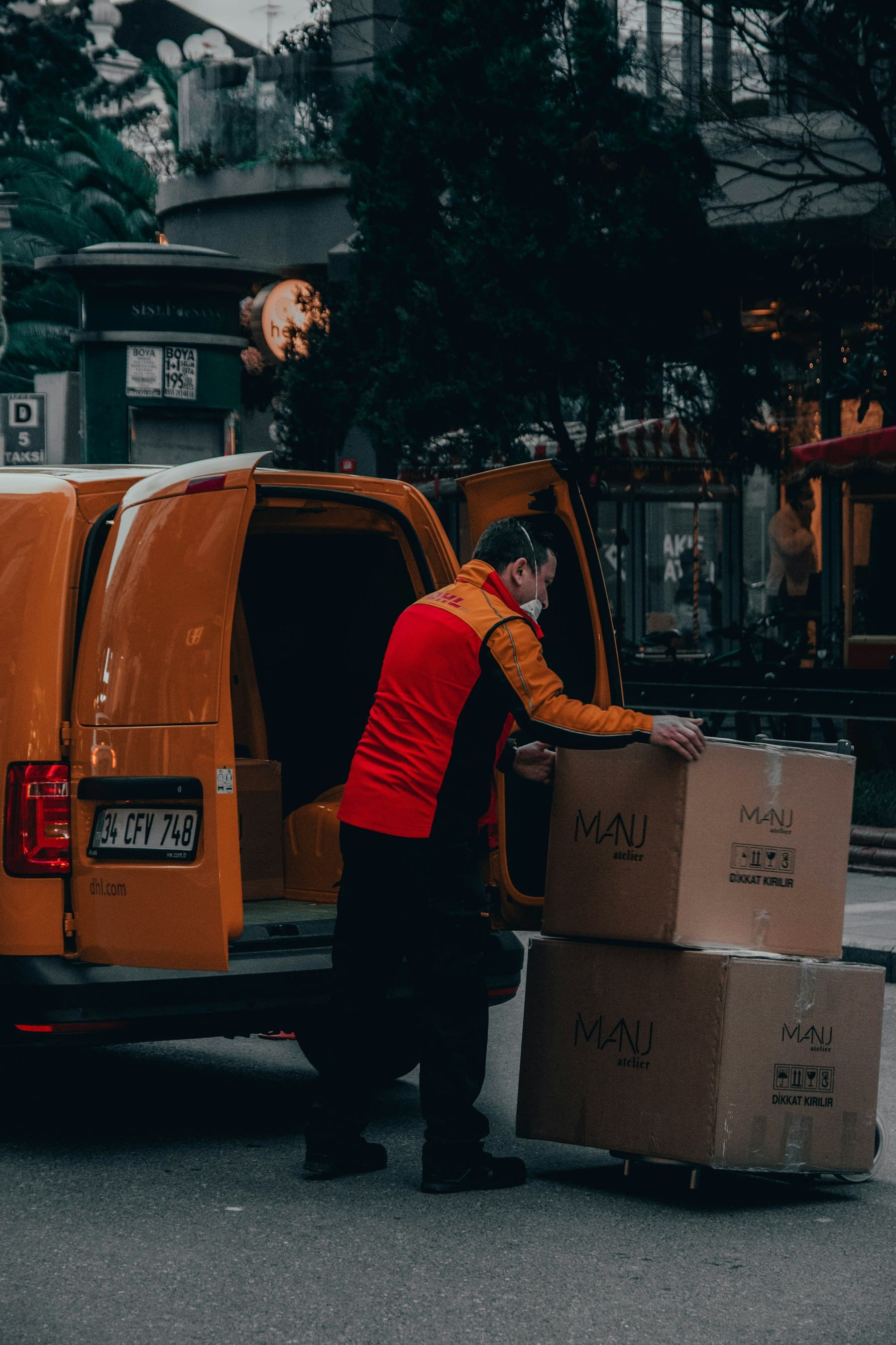 Delivery driver loading packages for an online store