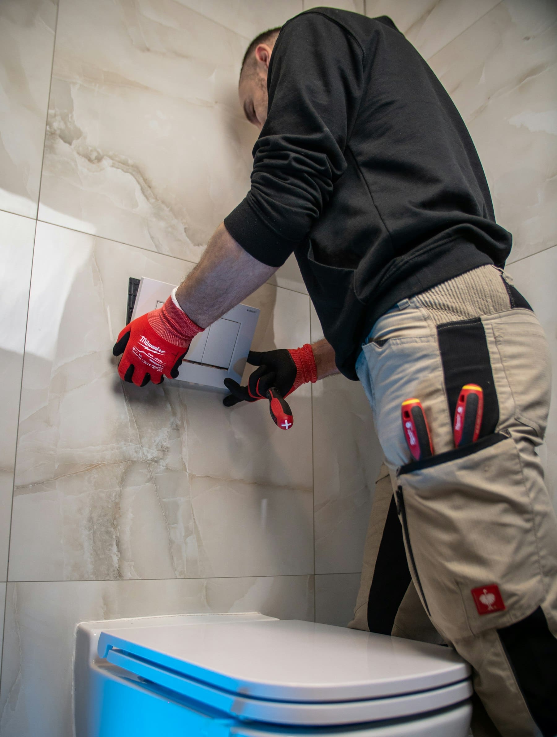 Plumber repairing a fixture on the job