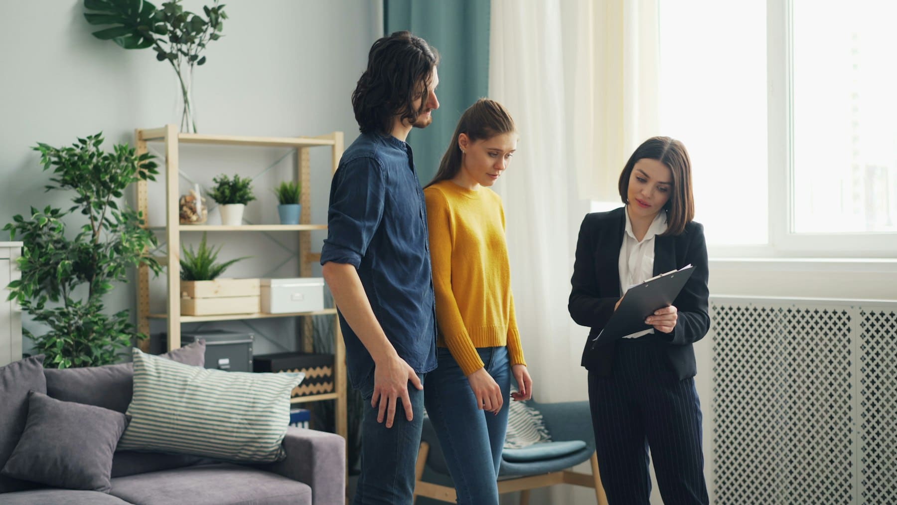 Real estate agent showing a home to clients